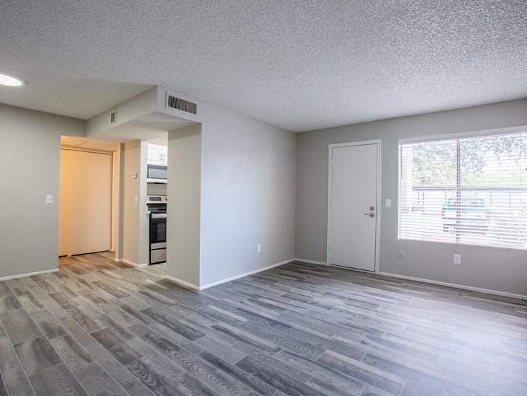 Tucson, AZ apartment with spacious floor plan and faux wood flooring at The Vintage Apartment complex